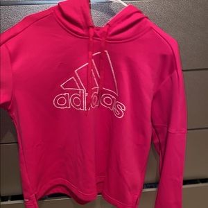 It’s a crop top hoodie from adidas